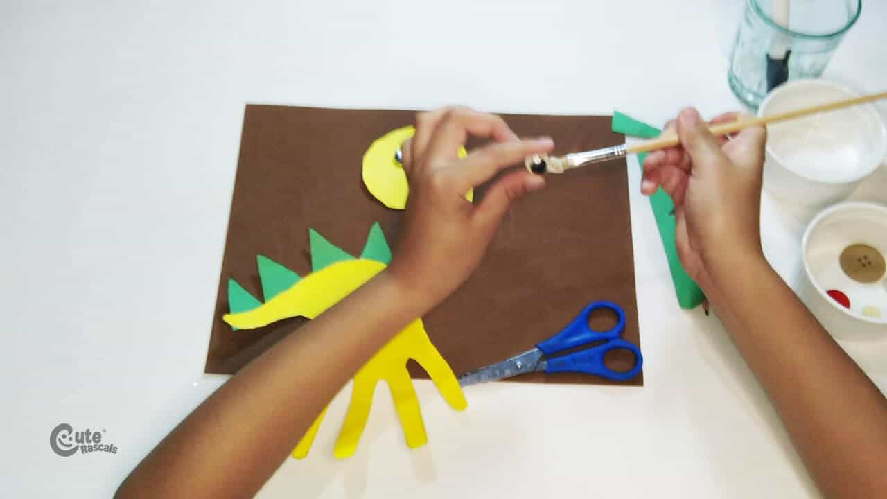 glue the eyes to dinosaur